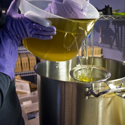 Pouring oils for goat milk soap making