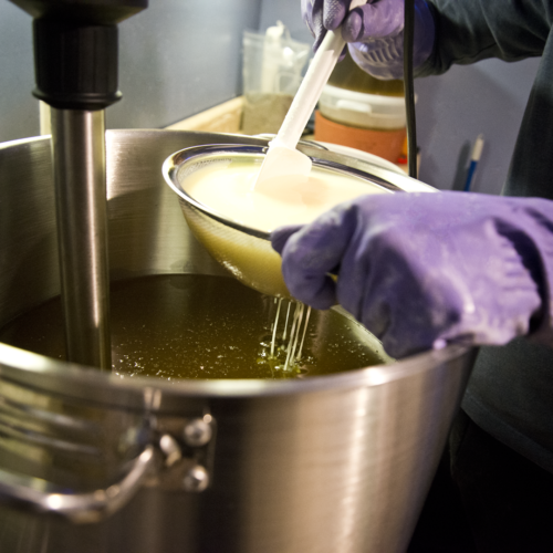 Straining Milk in goat milk soap making